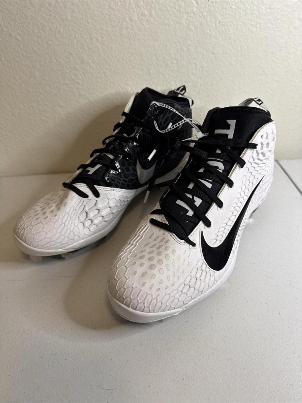 Nike Kids White and Black Soccer Cleats with Textured Upper